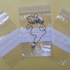 SZT03 - Saquinho Plástico ZIP com Tarja 7x10cm- Pacote com 100 unidades